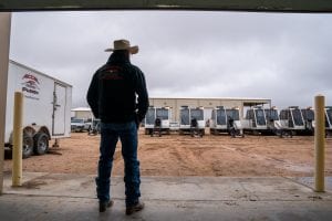 Man in Cowboy Hat Viewing Fusion Machines